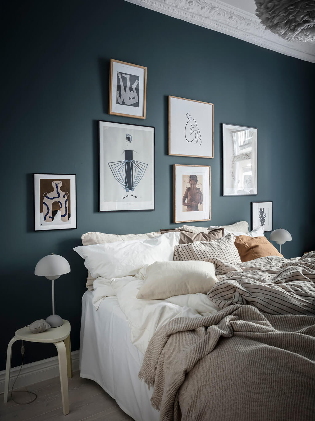 A Black Dining Room in a Stylish Apartment 13 blue-bedroom-gallery-wall-nordroom