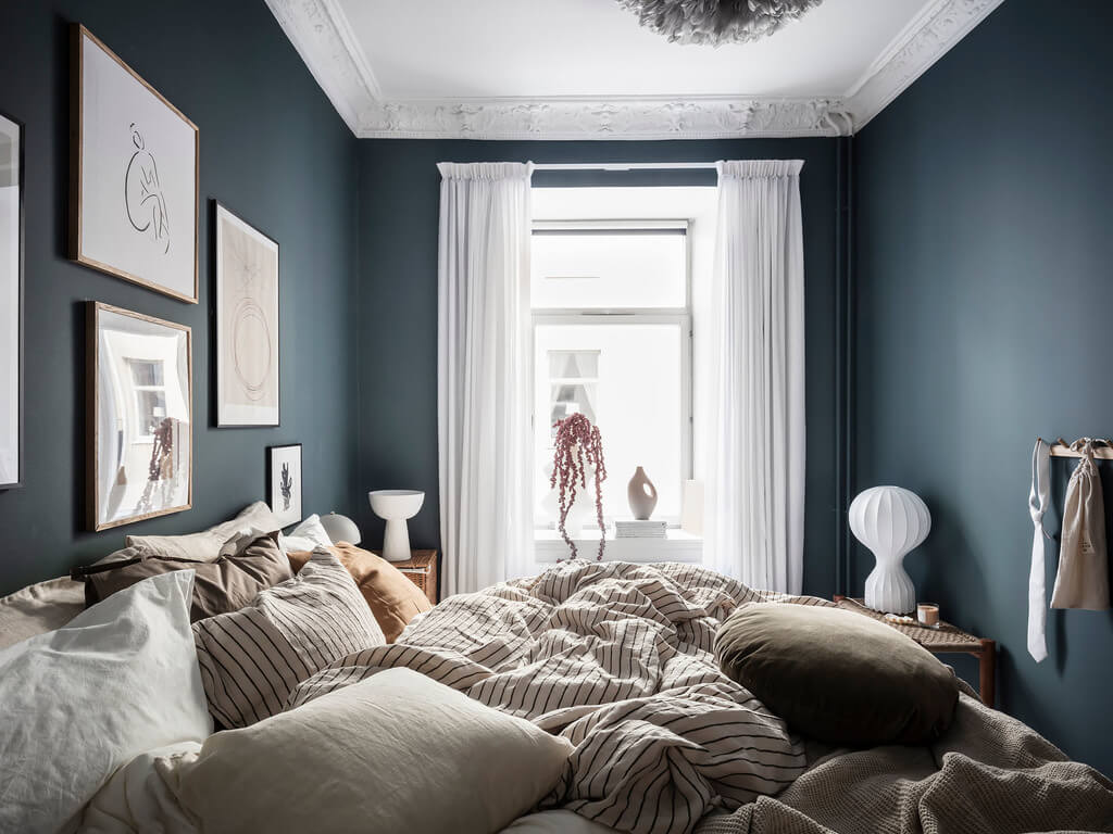 A Black Dining Room in a Stylish Apartment 12 blue-cozy-scandinavian-bedroom-nordroom