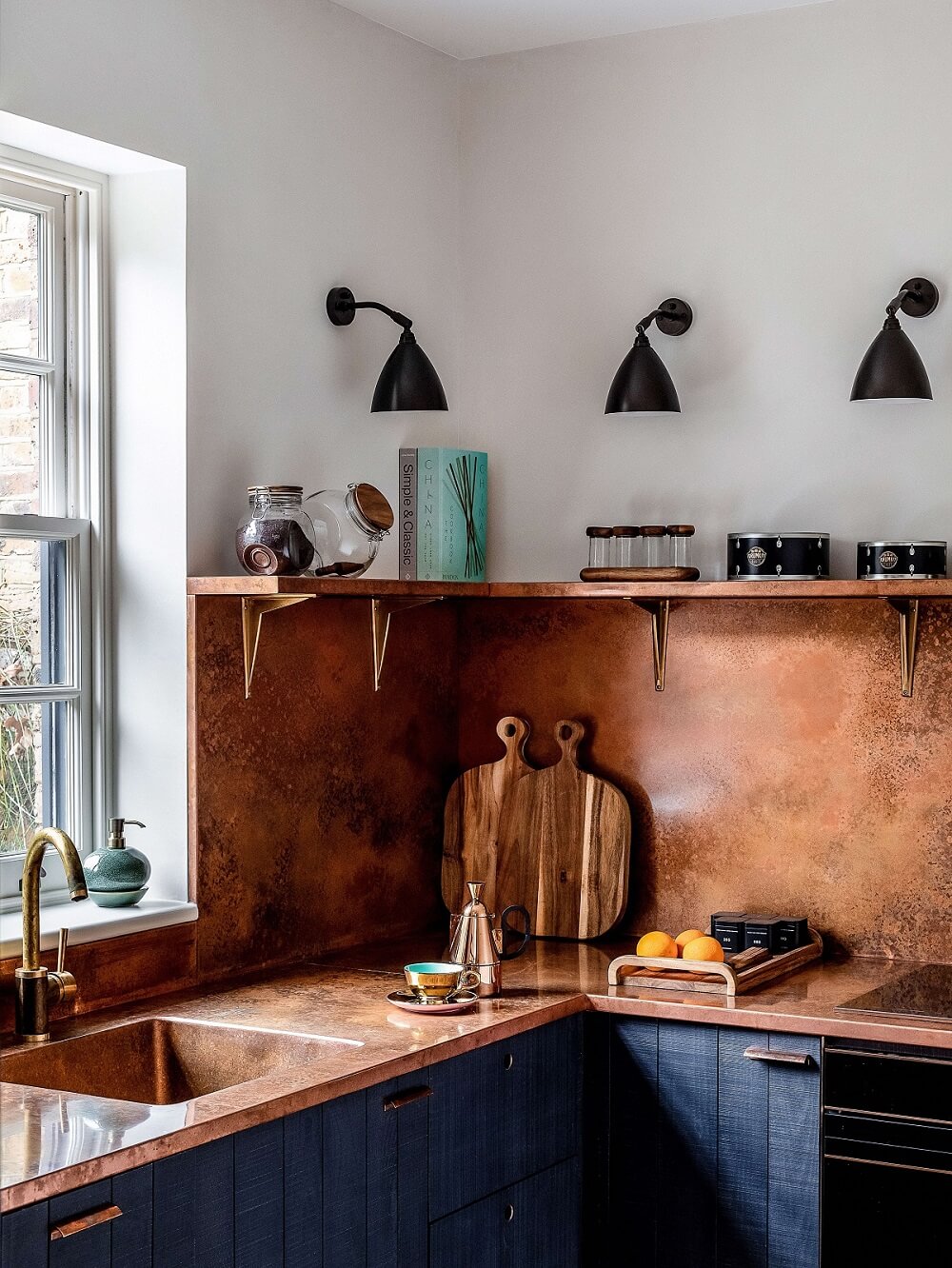 A Modern Playful Mews House in London 5 blue-devol-kitchen-copper-countertop-backsplash-mews-house-nordroom