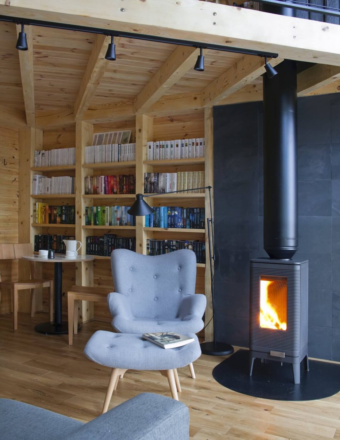 bookshelves-cast-iron-stove-cabin-nordroom