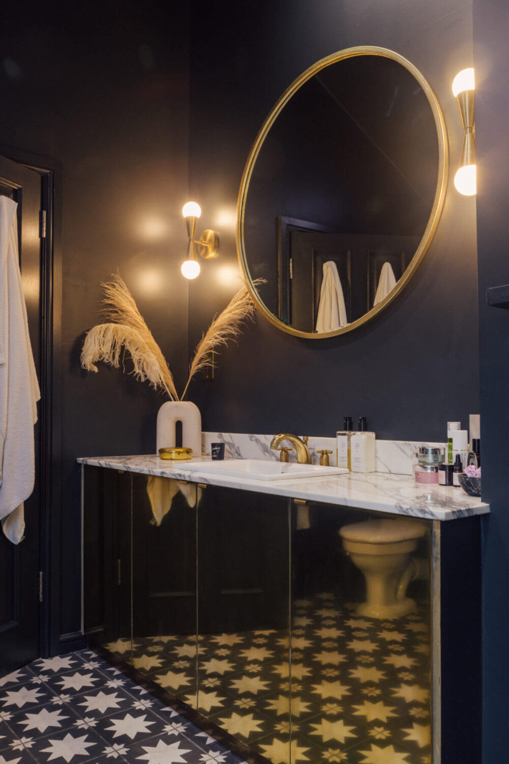 Color in a Renovated Victorian Townhouse in London 21 dark-blue-bathroom-gold-cabinet-nordroom
