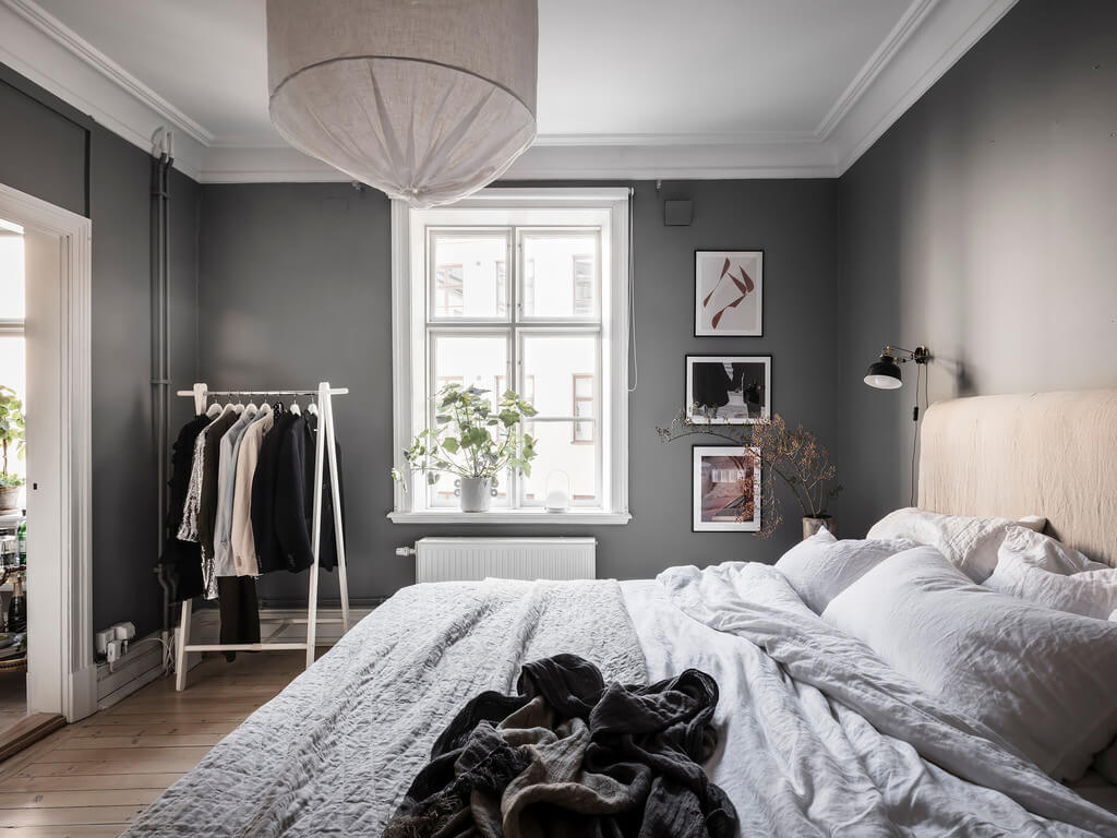 A Stylish Gray Scandinavian Apartment 15 gray-bedroom-clothing-rack-scandinavian-design-nordroom
