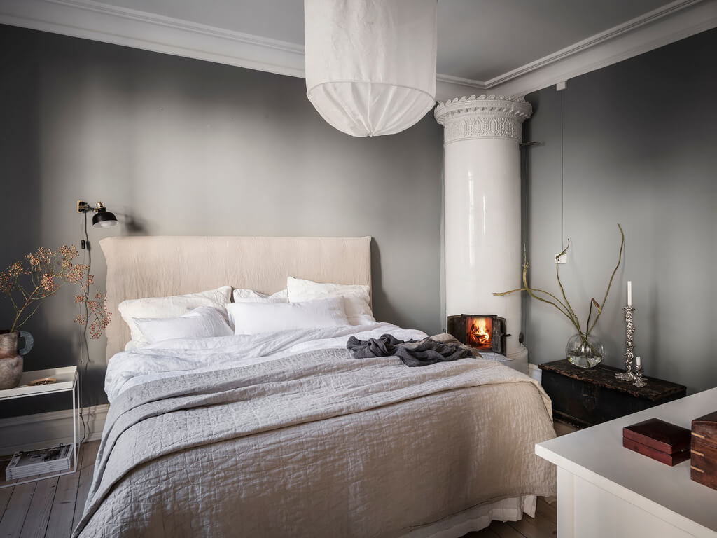 A Stylish Gray Scandinavian Apartment 11 gray-scandinavian-bedroom-fireplace-nordroom