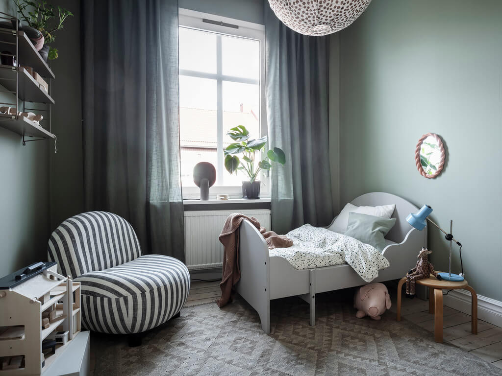 Subtle Color Touches in a Light Apartment 16 green-scandinavian-kids-bedroom-nordroom