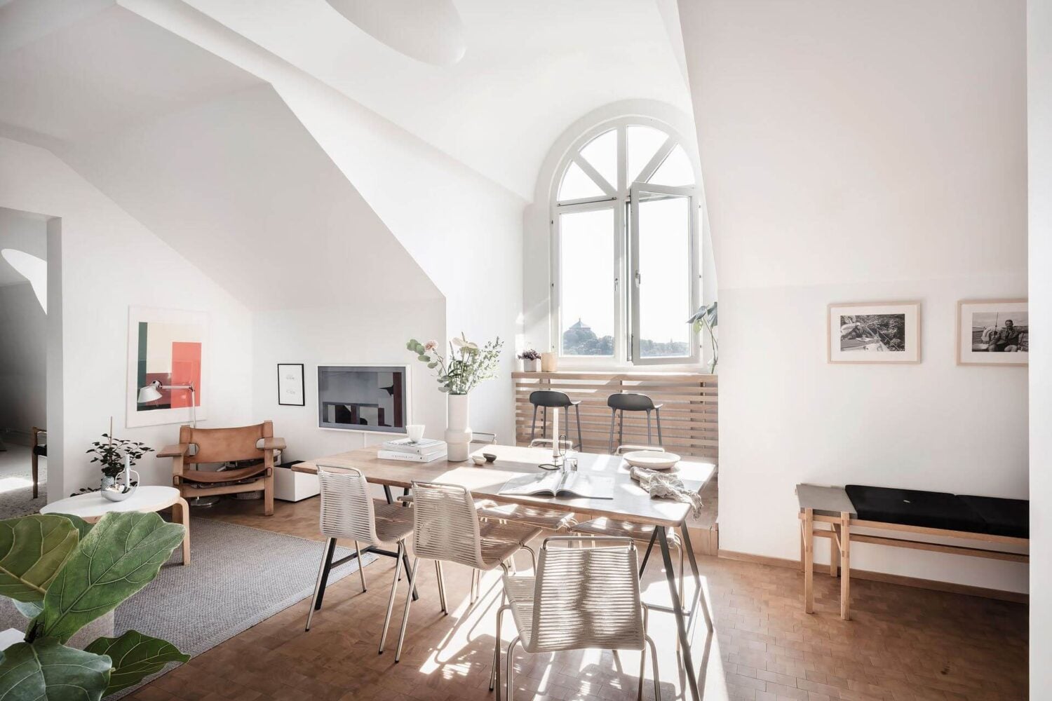 Window Seats & Creative Ideas in a Light Attic Apartment 3 living-room-dining-table-slanted-ceilings-nordroom