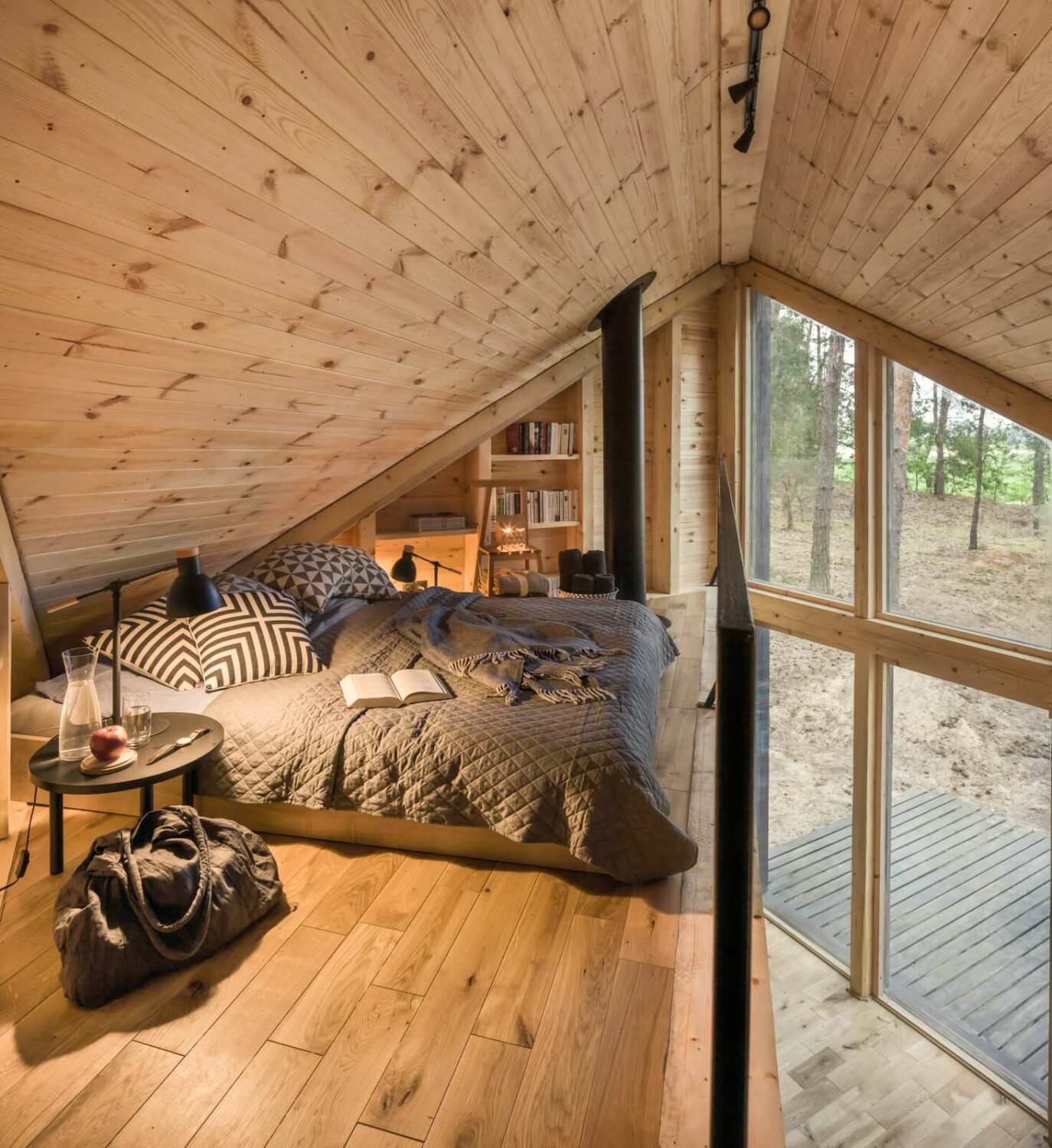 The Bookworm Cabin in Poland 8 loft-bedroom-bookshelves-cabin-poland-nordroom
