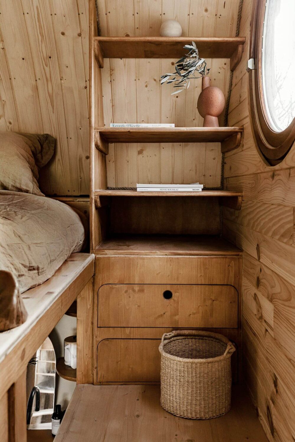 Curved Lines in a Wooden Tiny House 9 loft-bedroom-storage-tiny-house-nordroom