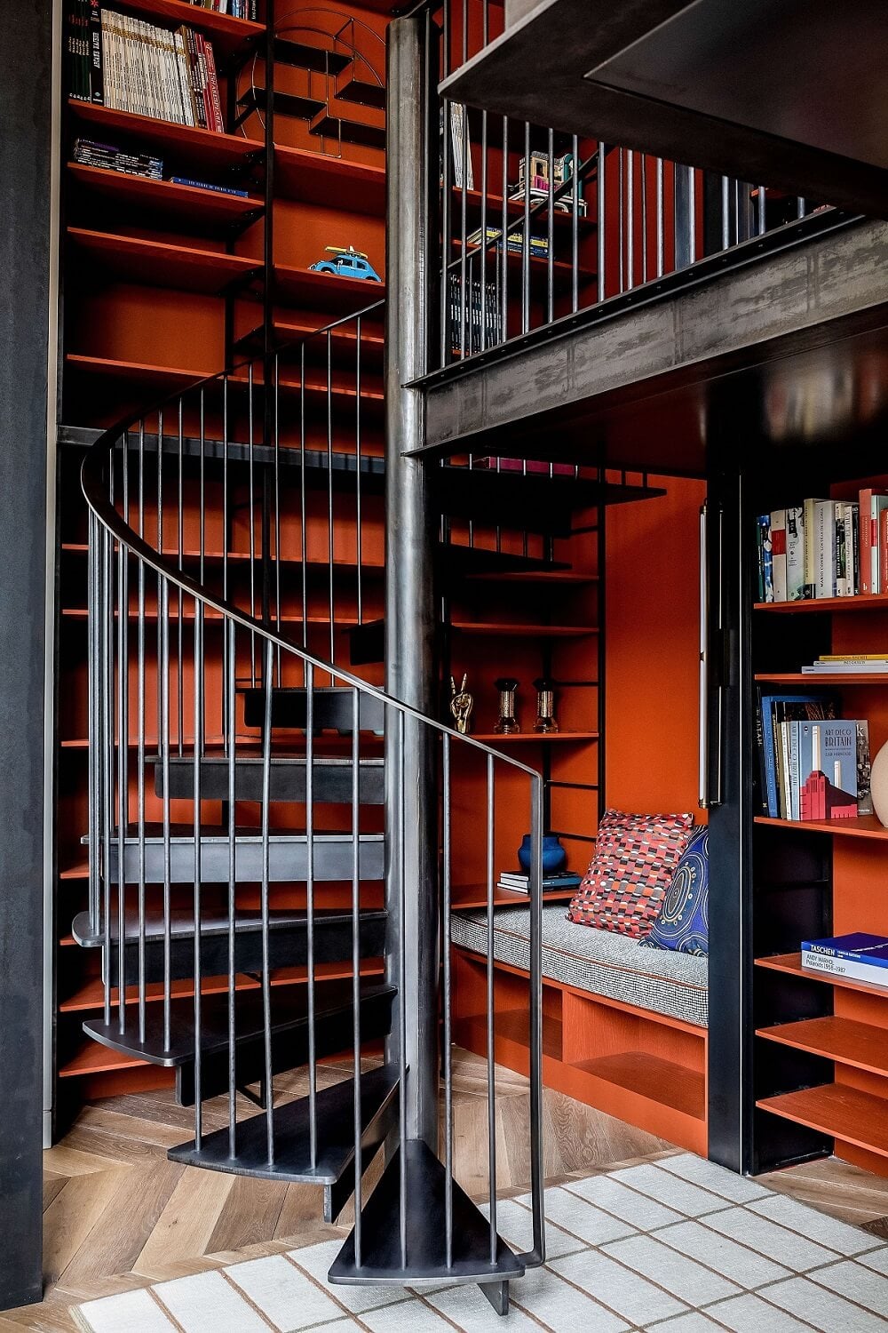 A Modern Playful Mews House in London 2 reading-nook-bookshelves-spiral-stairs-nordroom