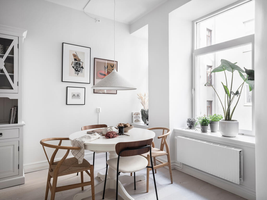 A Black Dining Room in a Stylish Apartment 17 round-kitchen-table-nordroom
