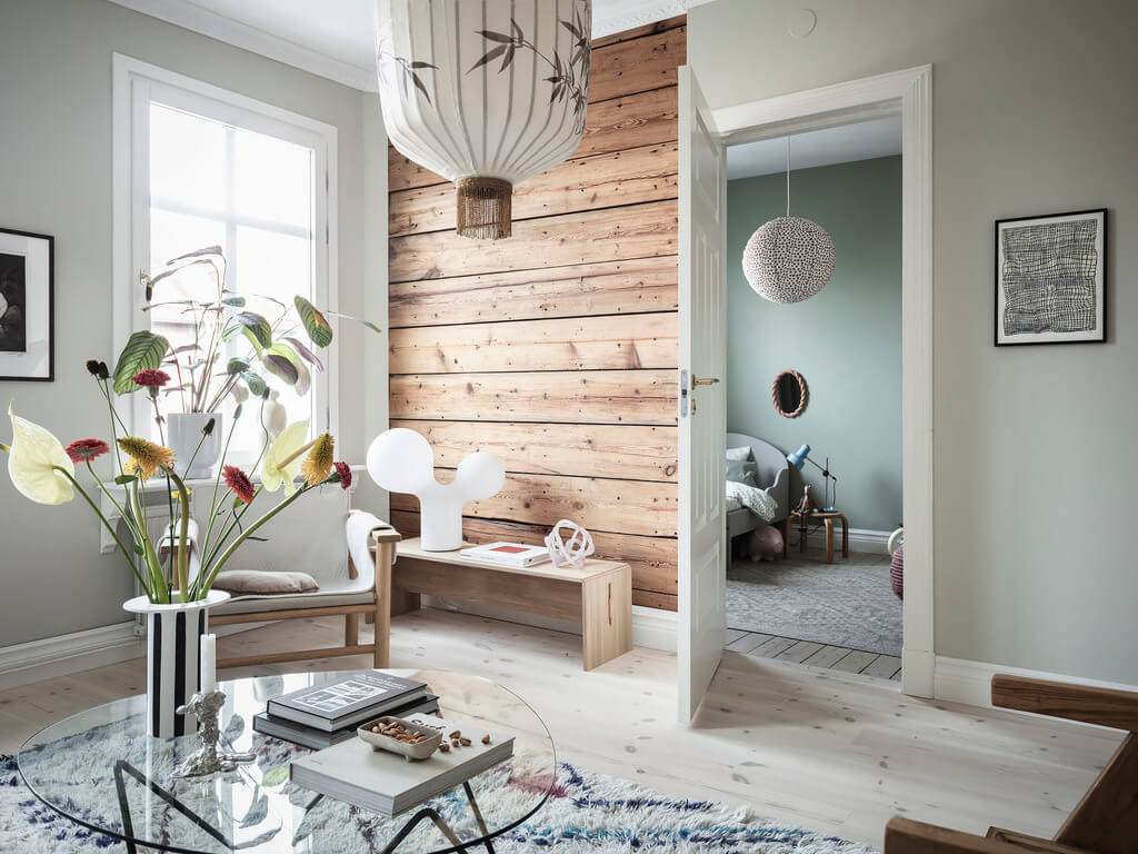 Subtle Color Touches in a Light Apartment 6 rustic-wooden-wall-scandinavian-living-room-nordroom