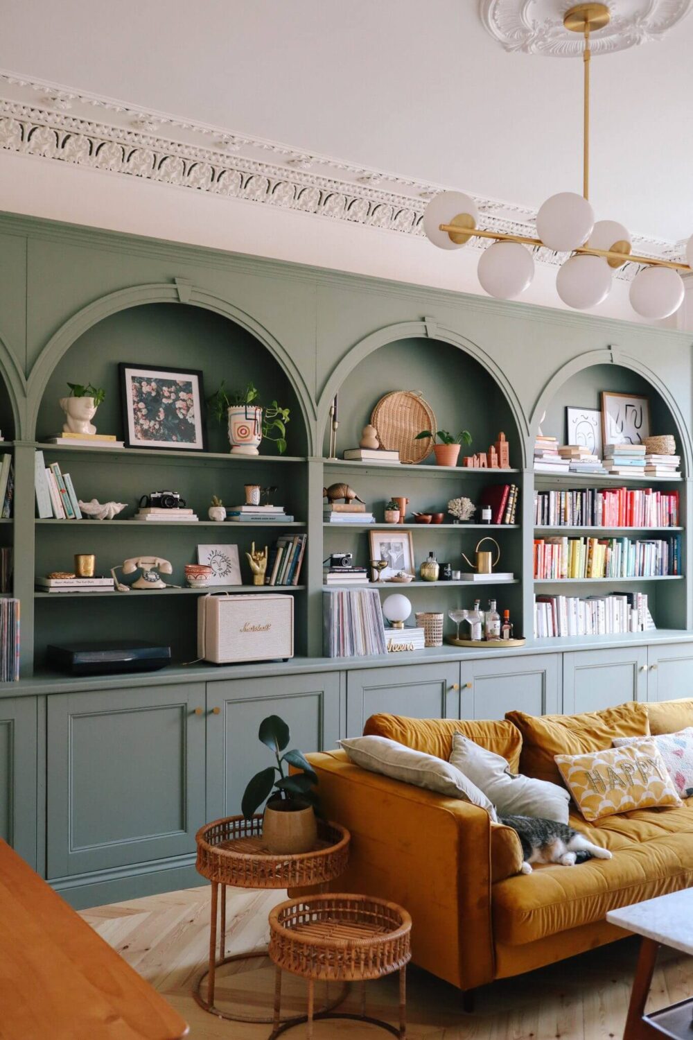 Benjamin Moore Color of the Year 2022: October Mist 6 sage-green-bookshelves-yellow-sofa-nordroom