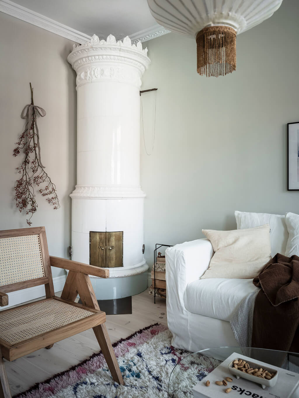 Subtle Color Touches in a Light Apartment 4 scandinavian-living-room-fireplace-nordroom