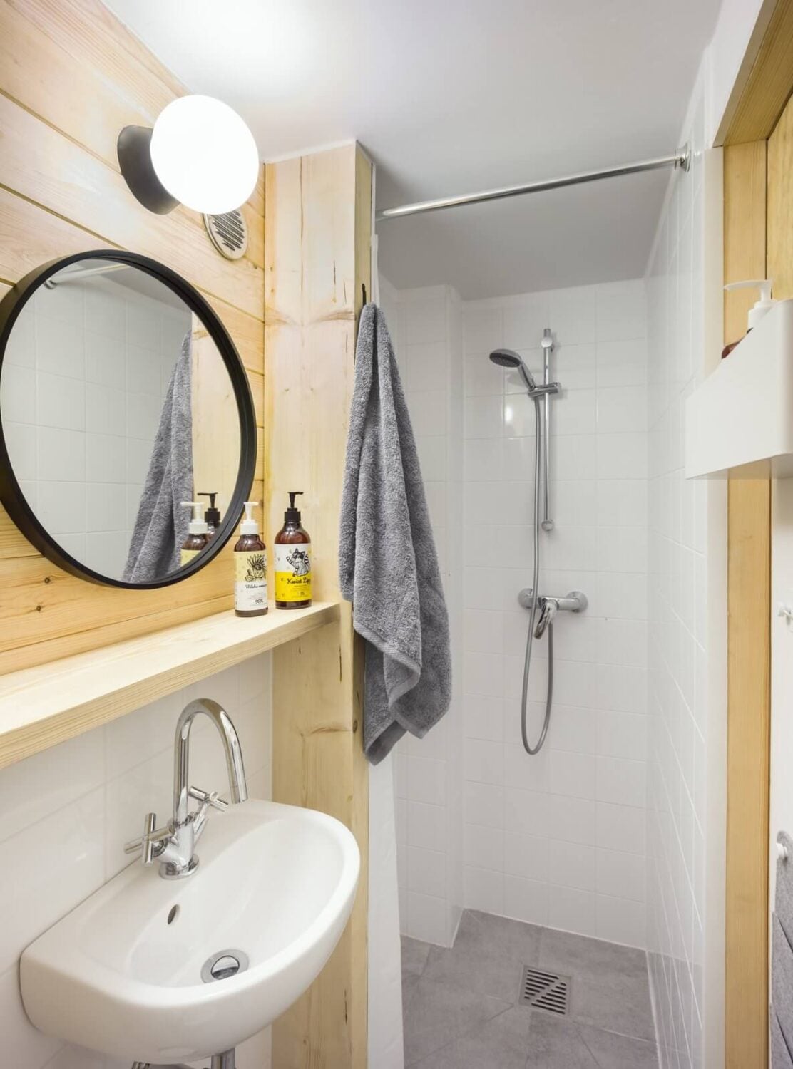 The Bookworm Cabin in Poland 9 small-bathroom-grey-white-tiles-wood-nordroom