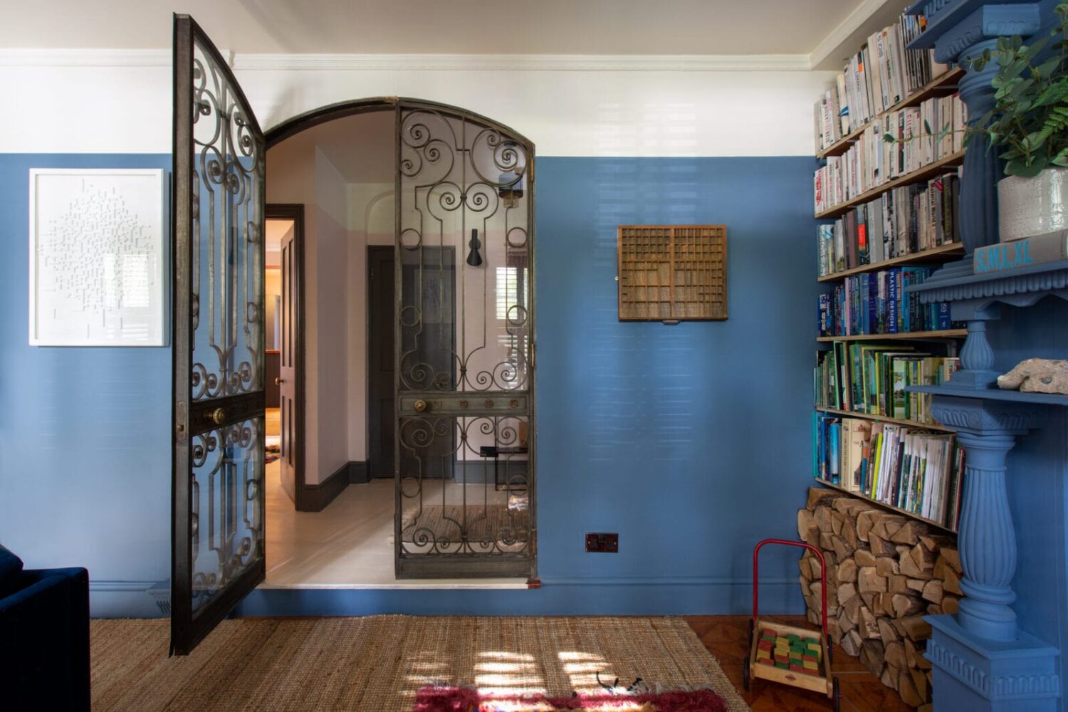 A Colorful Georgian Home in England 7 steel-glass-doors-blue-living-room-nordroom