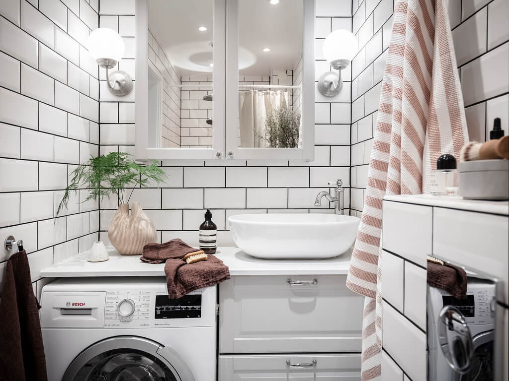 Subtle Color Touches in a Light Apartment 18 tiny-bathroom-white-tiles-nordroom