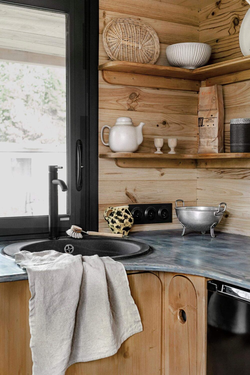 Curved Lines in a Wooden Tiny House 6 tiny-house-curved-kitchen-open-shelves-nordroom