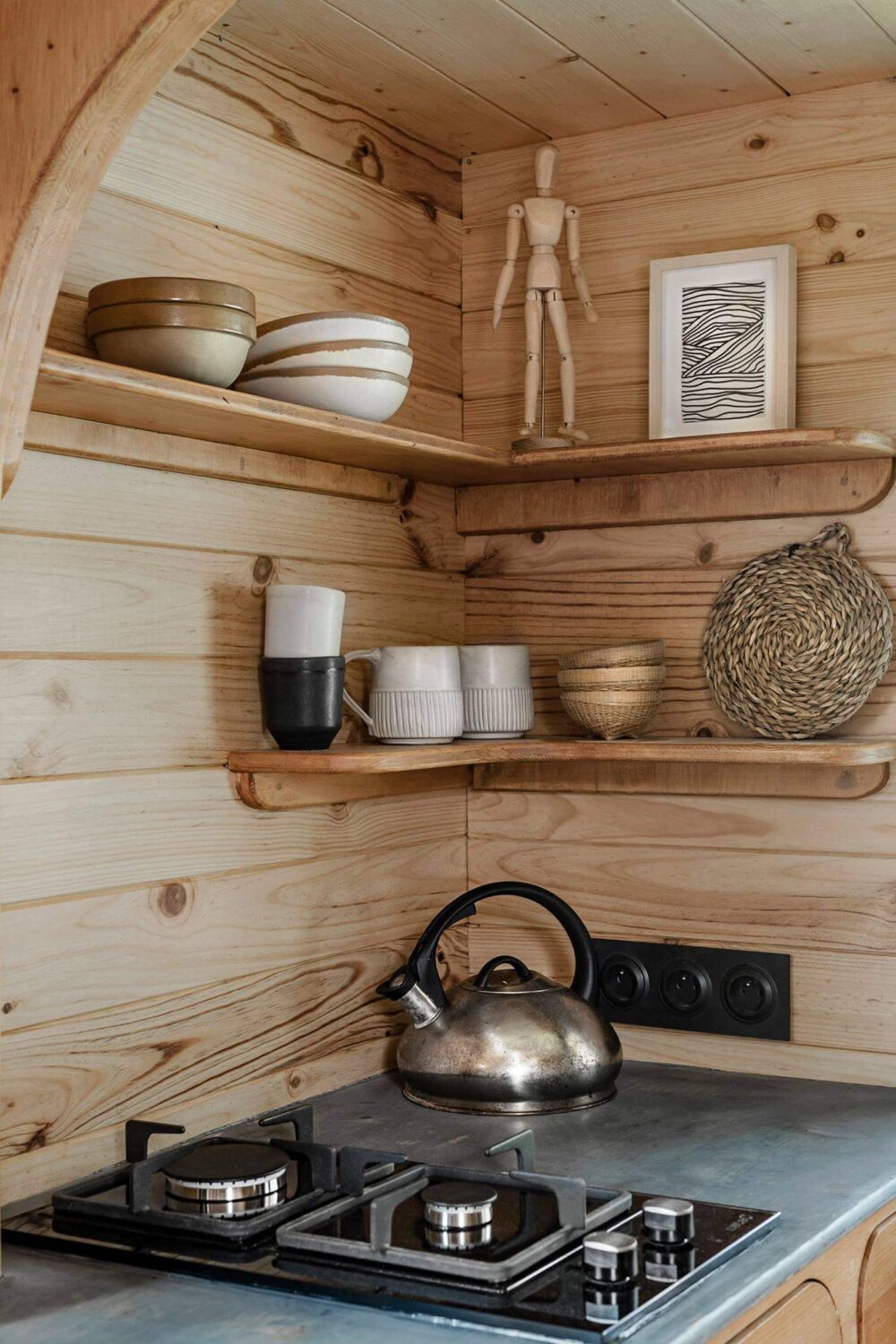 Curved Lines in a Wooden Tiny House 5 tiny-house-kitchen-open-shelves-nordroom