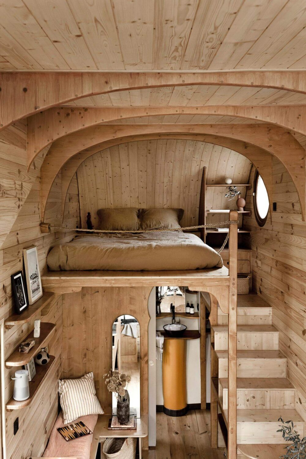 Curved Lines in a Wooden Tiny House 10 tiny-house-loft-bedroom-wood-curved-nordroom