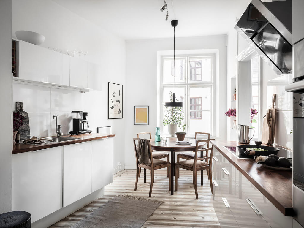 A Stylish Gray Scandinavian Apartment 19 white-kitchen-dining-table-nordroom