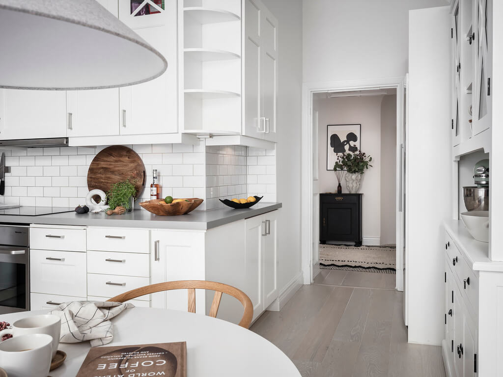 A Black Dining Room in a Stylish Apartment 18 white-kitchen-nordroom