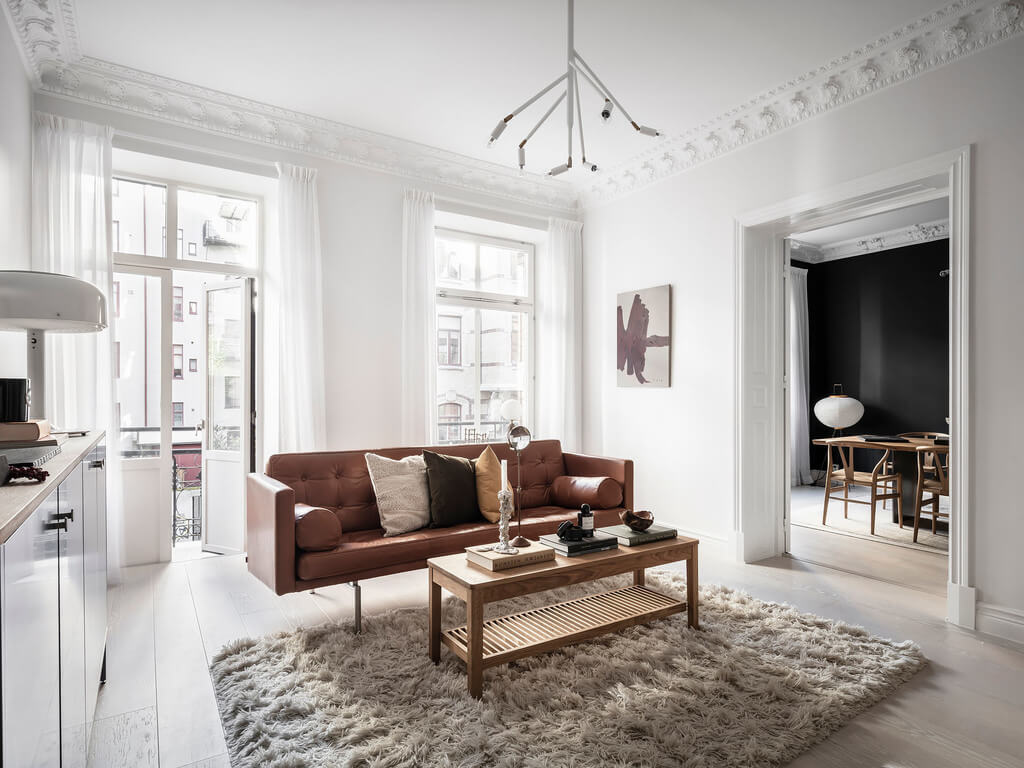 A Black Dining Room in a Stylish Apartment 8 white-living-room-nordroom