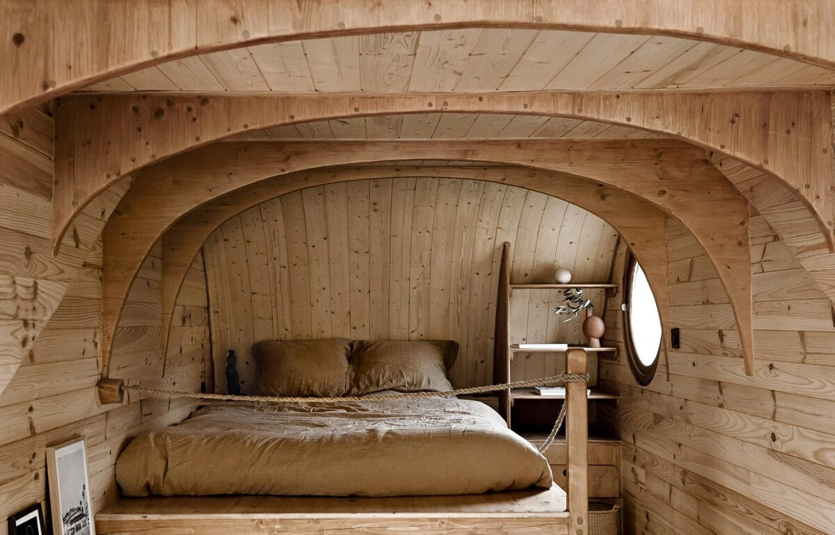 Curved Lines in a Wooden Tiny House 8 wooden-loft-bedroom-tiny-house-nordroom