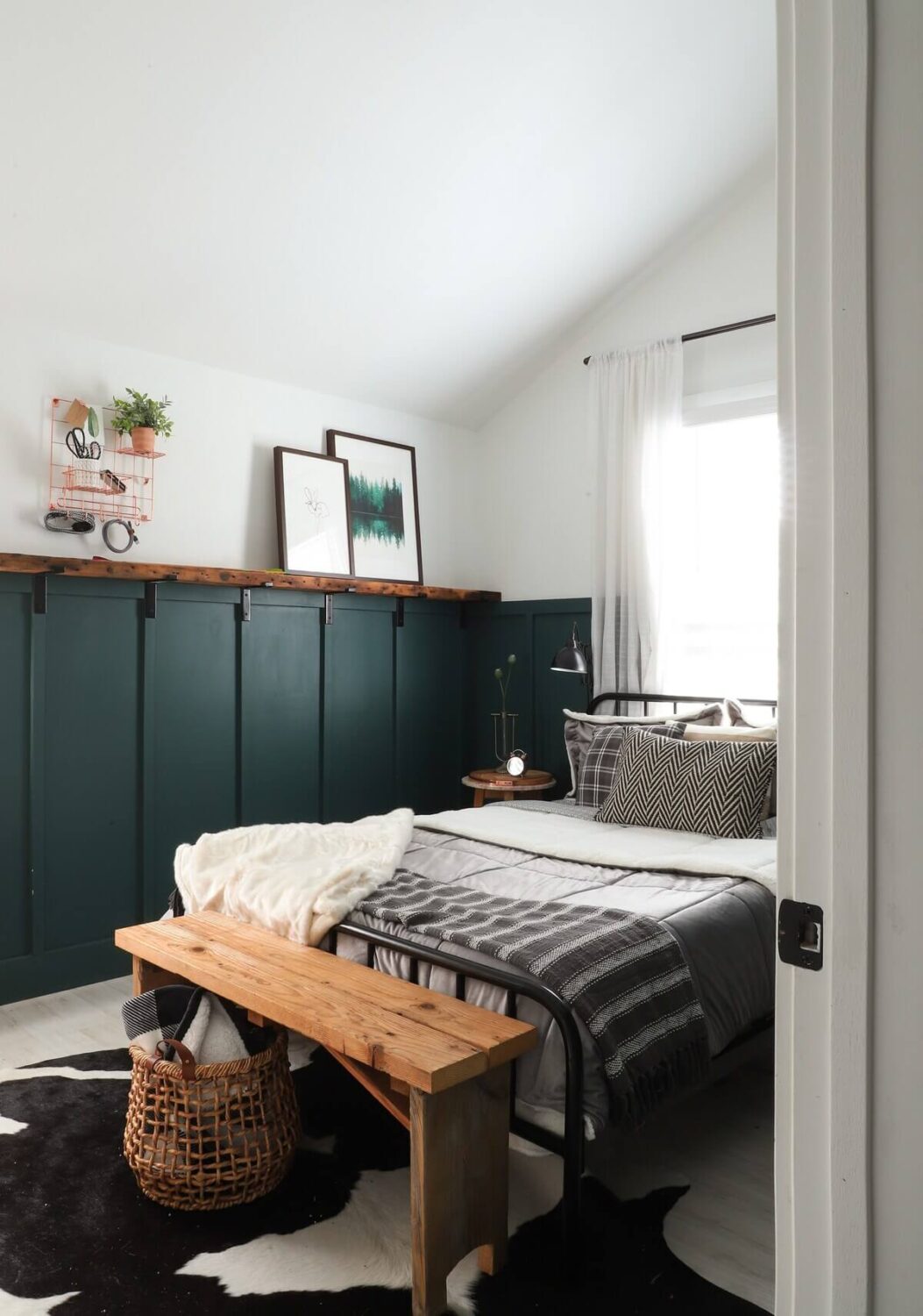 A Bright Renovated Home in Milwaukee 15 blue-green-wall-panels-bedroom-airbnb-nordroom