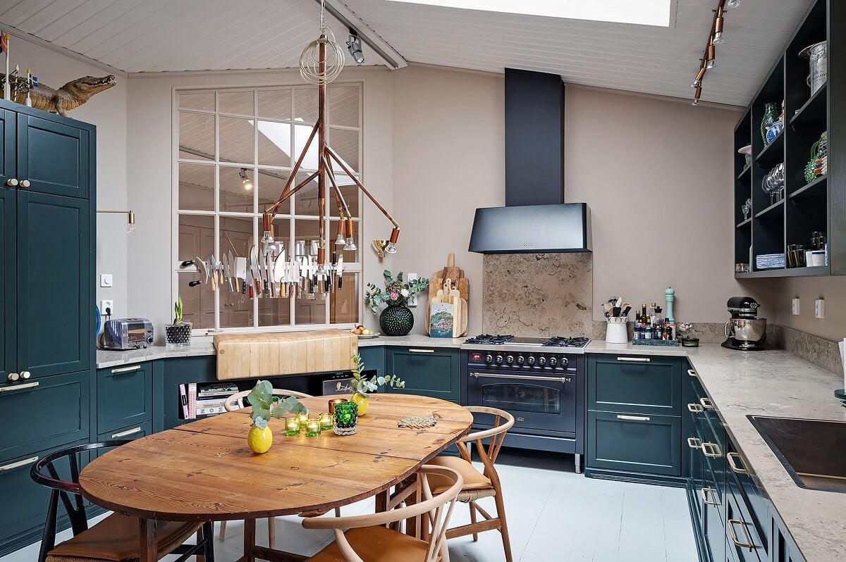The Colorful Home of Artist Bobo Wallmansson 2 blue-kitchen-dining-table-bobo-wallmansson-nordroom