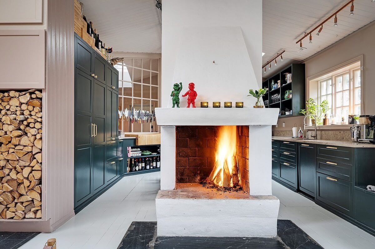 The Colorful Home of Artist Bobo Wallmansson 4 blue-kitchen-fireplace-colorful-eclectic-home-nordroom