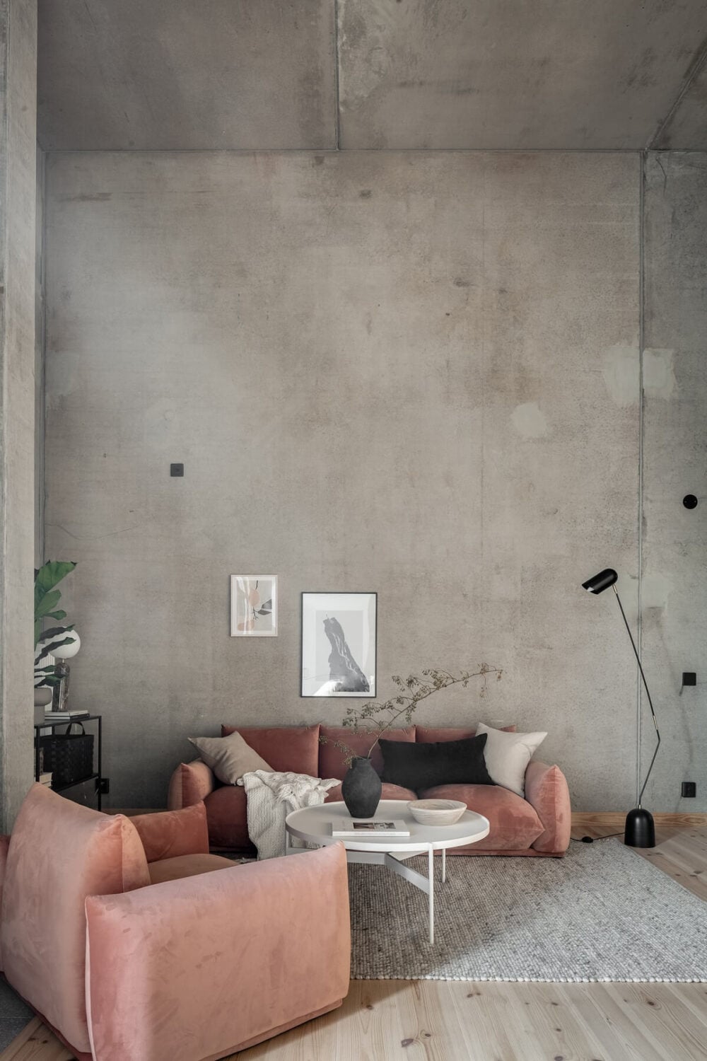 A Scandinavian Loft Made of Concrete and Wood 5 concrete-living-room-pink-sofa-nordroom