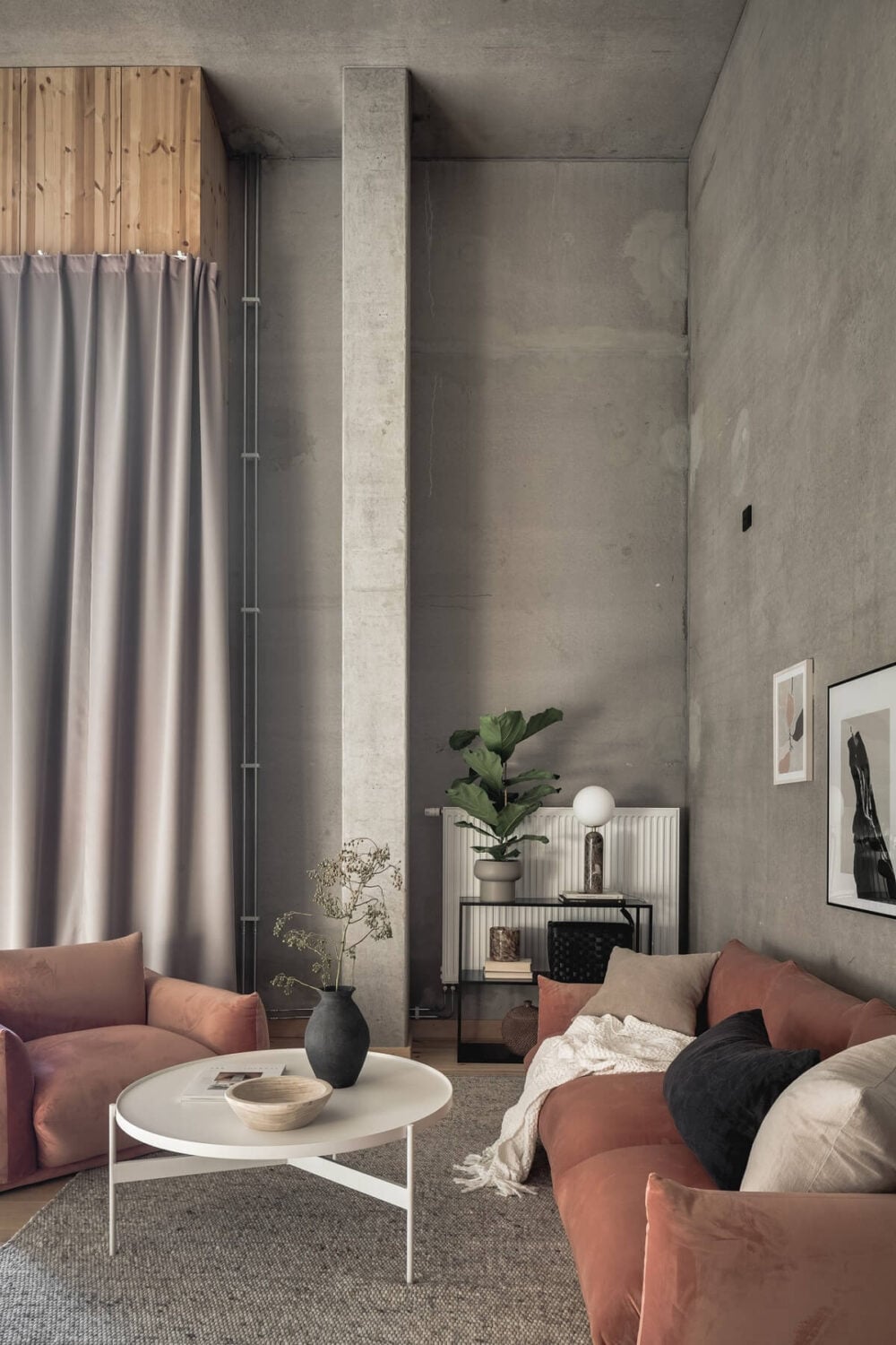 A Scandinavian Loft Made of Concrete and Wood 2 concrete-loft-living-room-pink-sofa-nordroom
