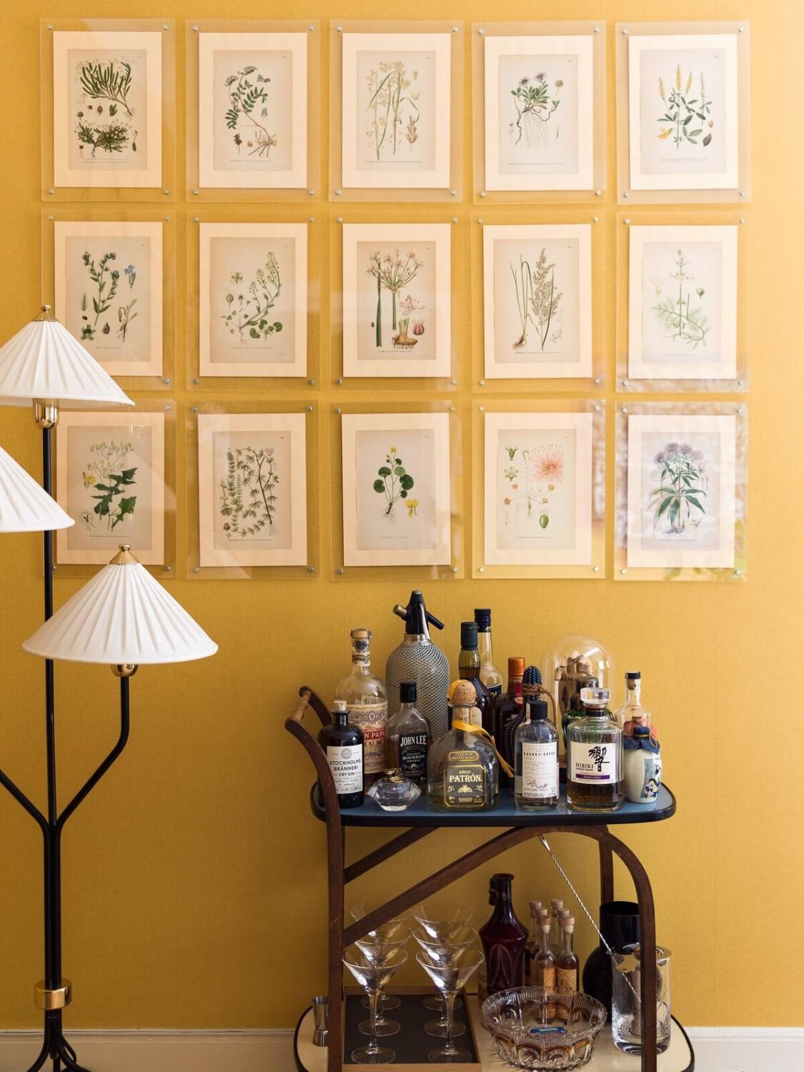 A Vibrant Colorful Scandinavian Apartment 7 floral-gallery-wall-yellow-living-room-nordroom
