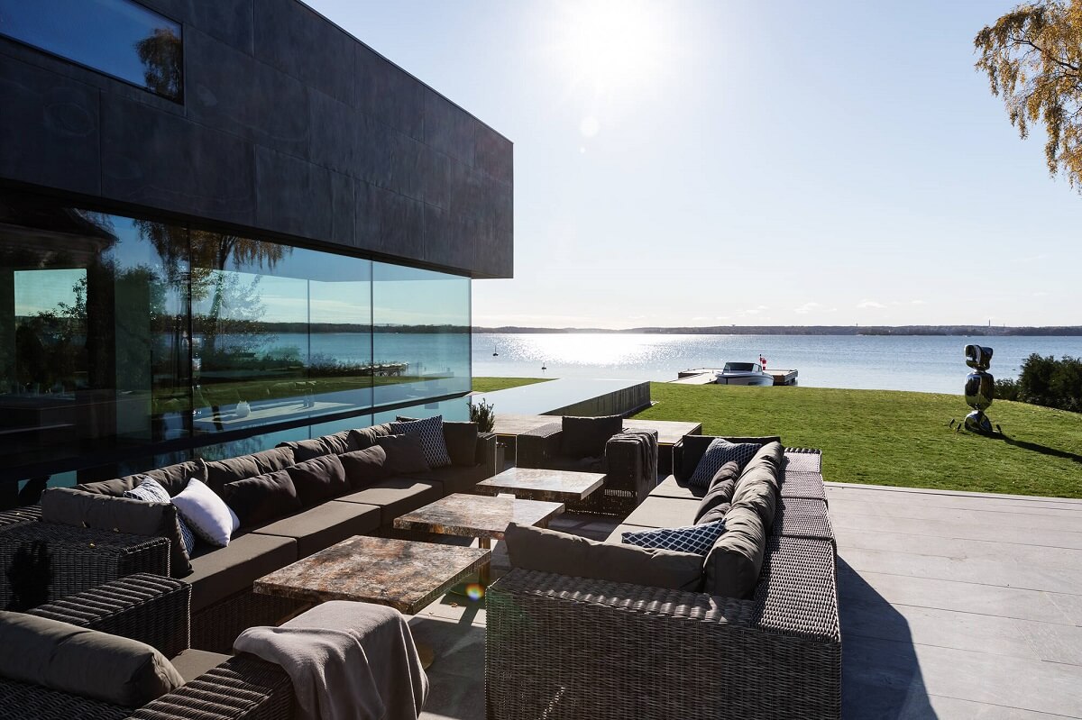 A Modern Architectural Villa in Sweden 31 garden-seating-sea-view-modern-architectural-villa-stockholm-sweden-nordroom