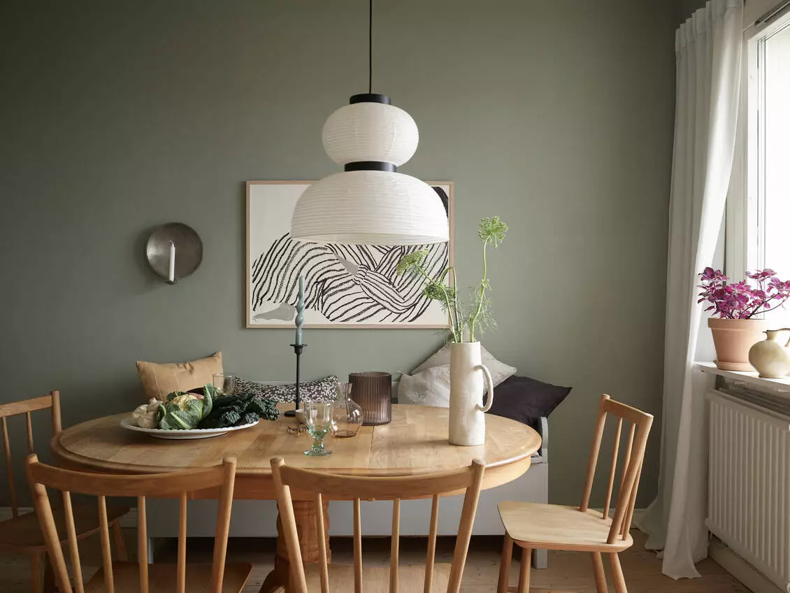 A Scandinavian Studio Apartment with Bed Nook 14 green-kitchen-dining-bench-scandinavian-nordroom