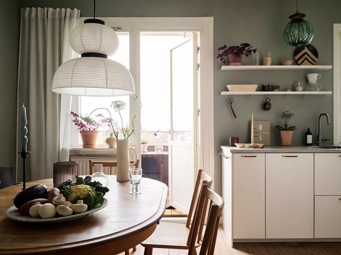 A Scandinavian Studio Apartment with Bed Nook 9 green-walls-scandinavian-kitchen-open-shelves-nordroom