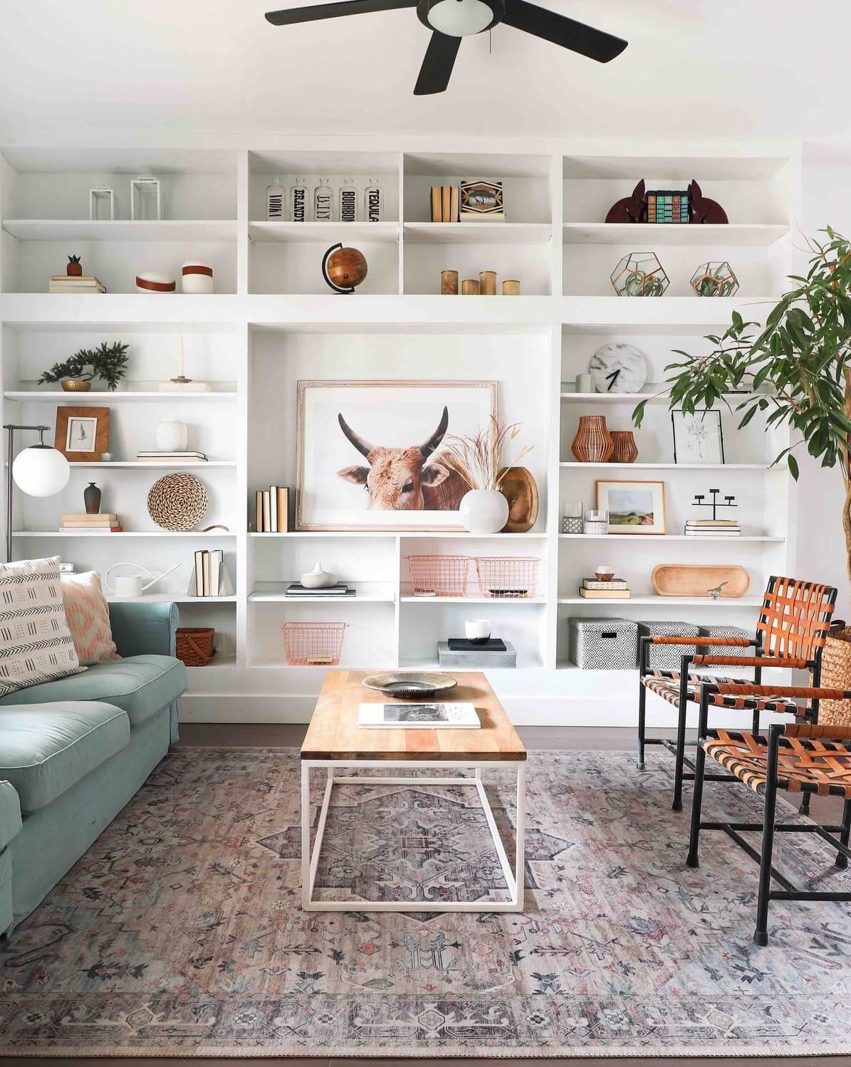 A Bright Renovated Home in Milwaukee 4 light-living-room-blue-sofa-built-in-bookshelves-nordroom