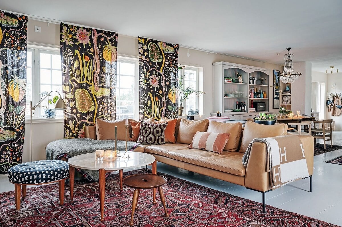 The Colorful Home of Artist Bobo Wallmansson 19 living-room-tan-leather-sofa-colorful-curtains-nordroom