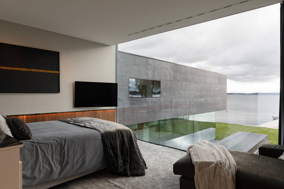 A Modern Architectural Villa in Sweden 19 modern-bedroom-floor-to-ceiling-glass-wall-modern-architectural-villa-stockholm-sweden-nordroom