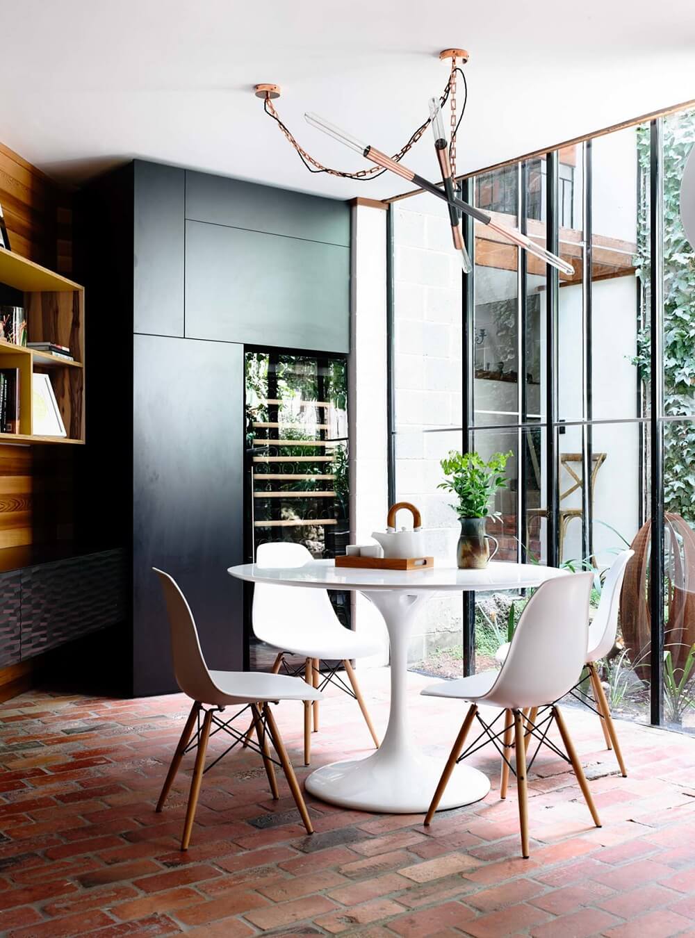 How To Style Terracotta Floor Tiles 12 modern-kitchen-and-dining-room-with-dramatic-lighting-and-terra-cotta-tile-nordroom