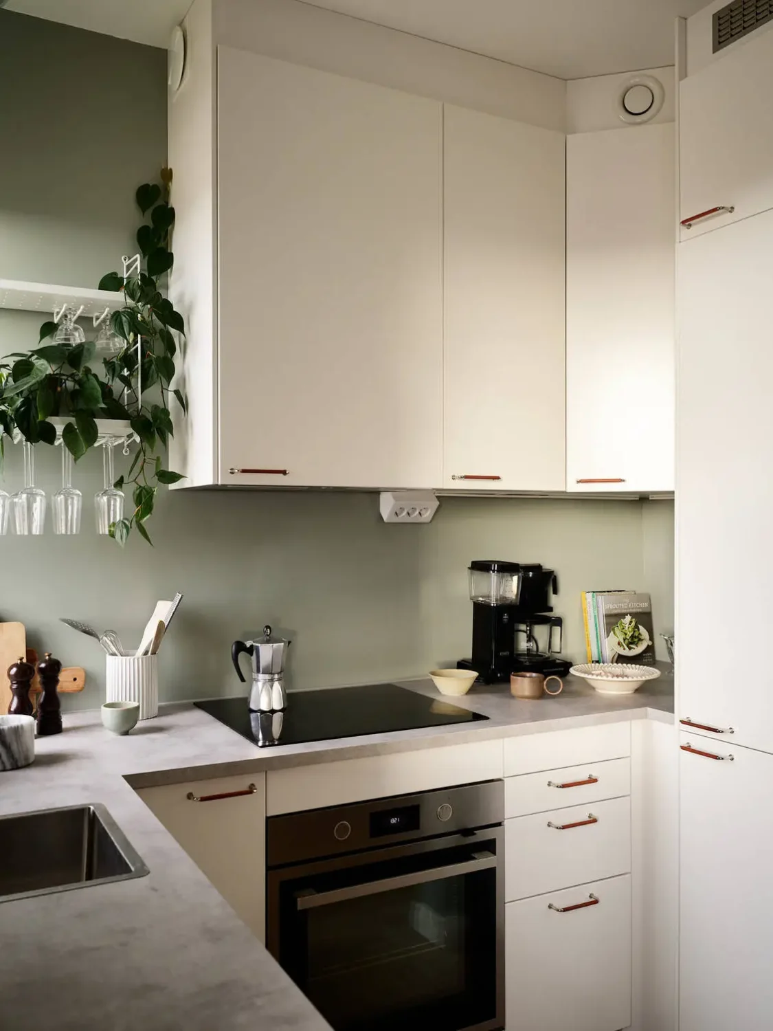 A Scandinavian Studio Apartment with Bed Nook 13 small-kitchen-studio-apartment-green-walls-nordroom