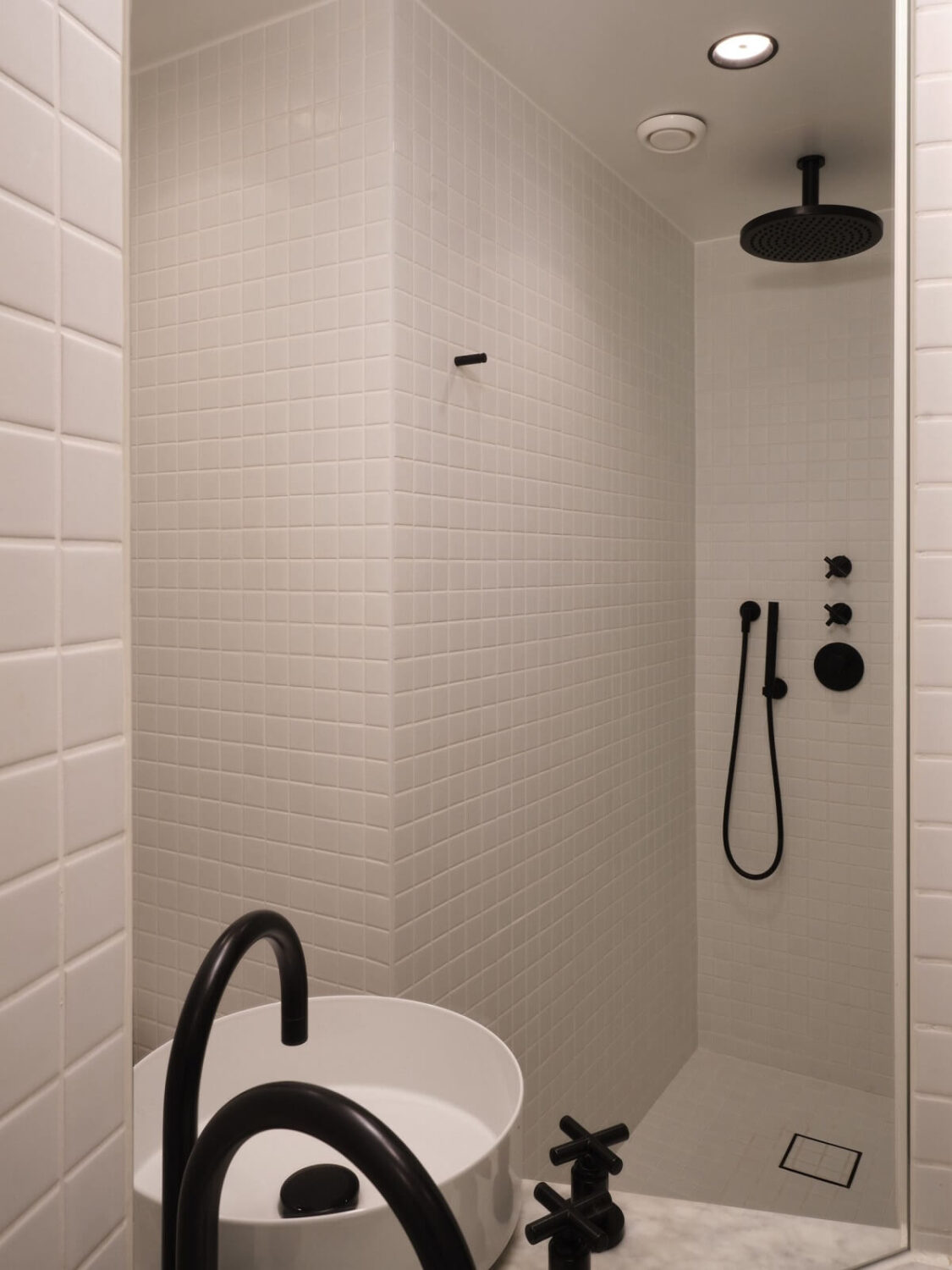 Apartment with Small Dark Blue Bedroom 16 white-bathroom-black-fittings-nordroom