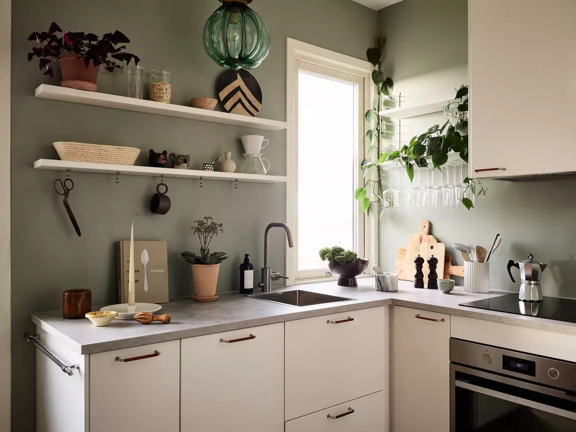 A Scandinavian Studio Apartment with Bed Nook 10 white-kitchen-open-shelves-green-walls-nordroom