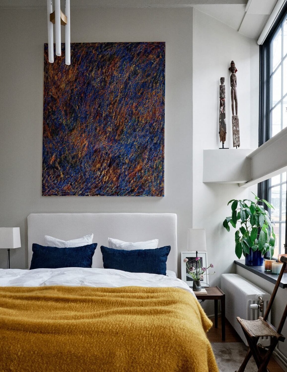 An Art-Filled Apartment in Stockholm 7 bedroom-colorful-art-yelow-textiles-scandinavian-design-nordroom