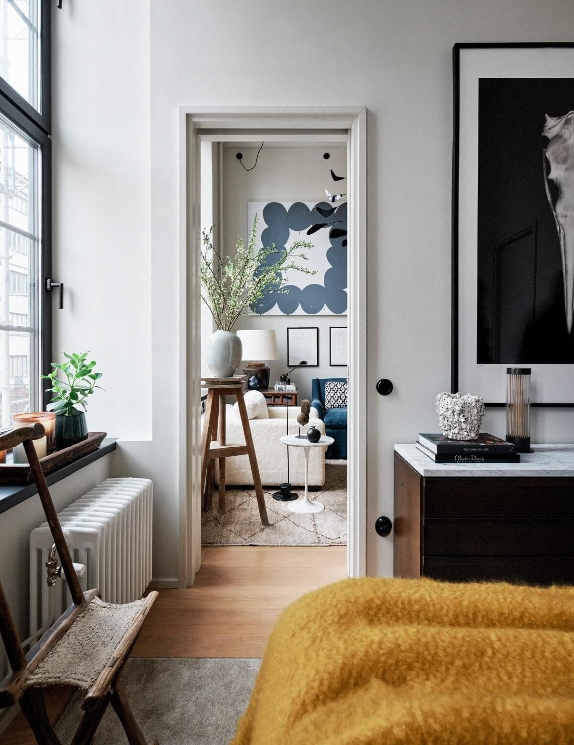 An Art-Filled Apartment in Stockholm 8 bedroom-yellow-bedspread-large-art-nordroom