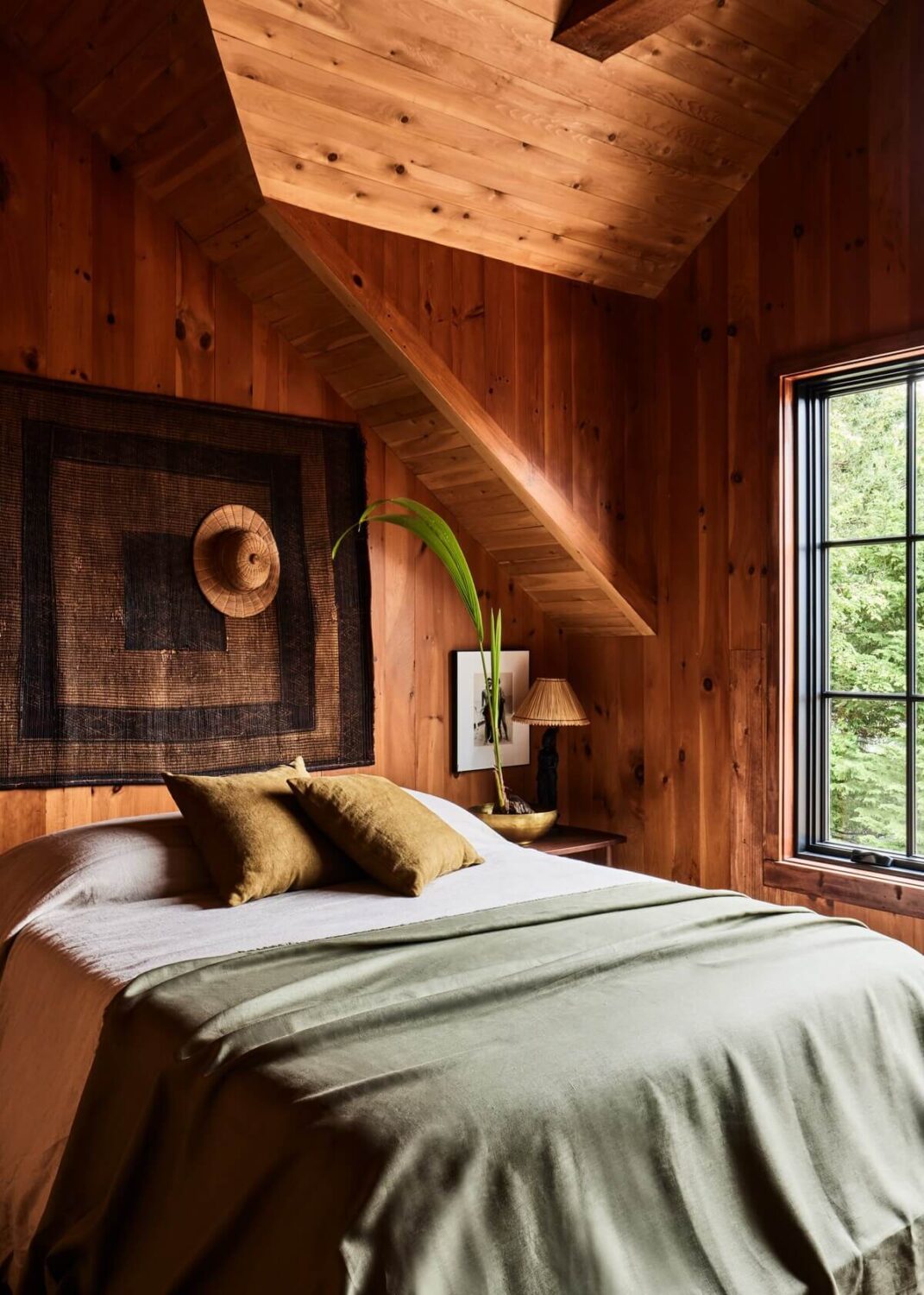 A Montauk Airbnb Designed by Robert McKinley 16 cabin-style-wood-bdroom-slanted-ceilings-airbnb-montauk-nordroom