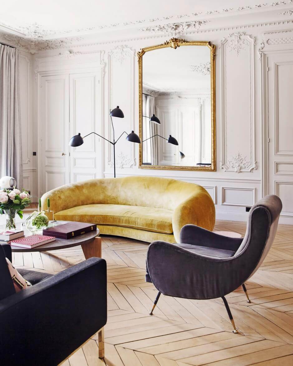 How To Style Your Home Like A Parisian Apartment 17 elegant-apartment-paris-curved-yellow-sofa-nordroom