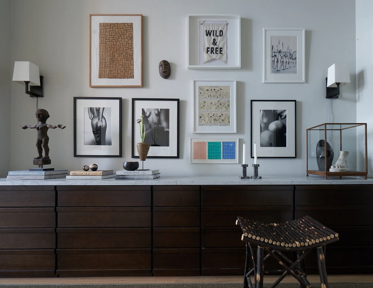 An Art-Filled Apartment in Stockholm 3 gallery-wall-storage-cabinets-wood-nordroom