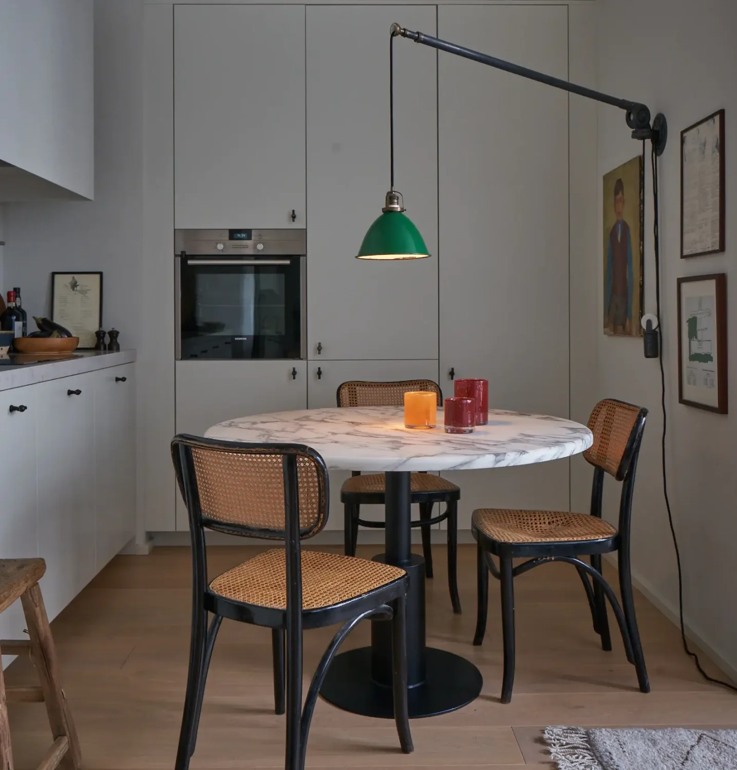 An Art-Filled Apartment in Stockholm 5 light-scandinavian-kitchen-round-dining-table-hanging-lamp-nordroom