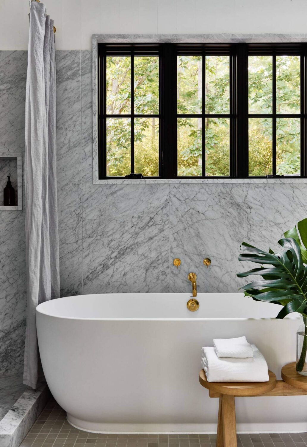 A Montauk Airbnb Designed by Robert McKinley 12 marble-bathroom-freestanding-bath-nordroom