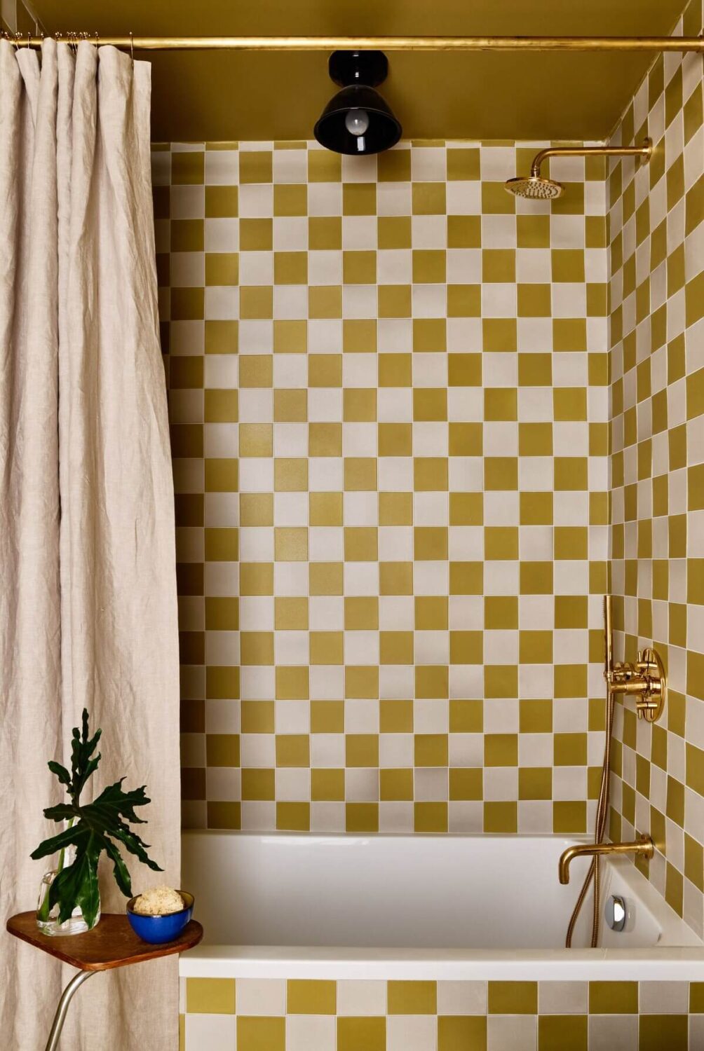 A Montauk Airbnb Designed by Robert McKinley 14 mustard-yellow-tiles-bathroom-nordroom